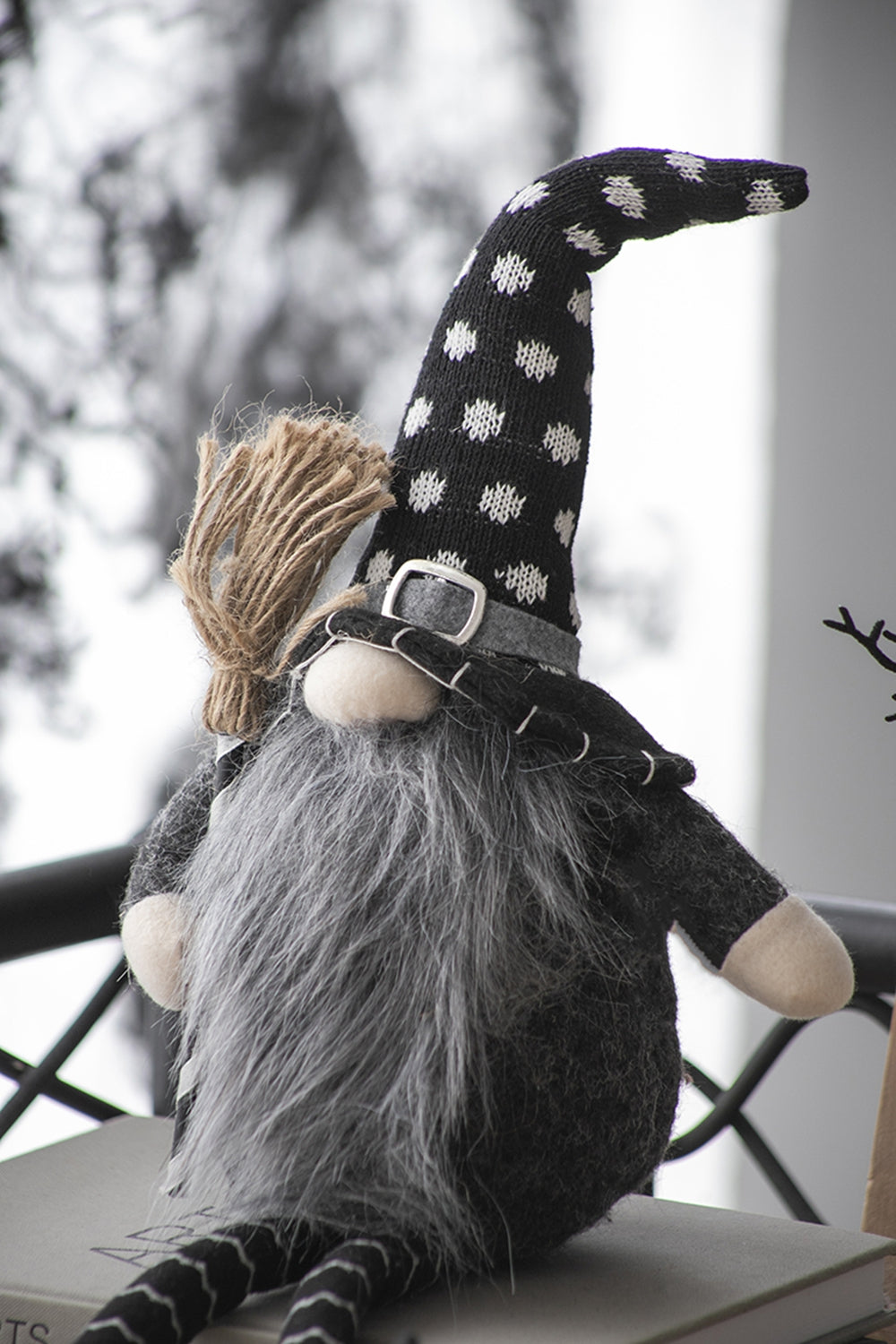 Black and white polka dot gnome with fuzzy grey beard holding a broom Halloween decor