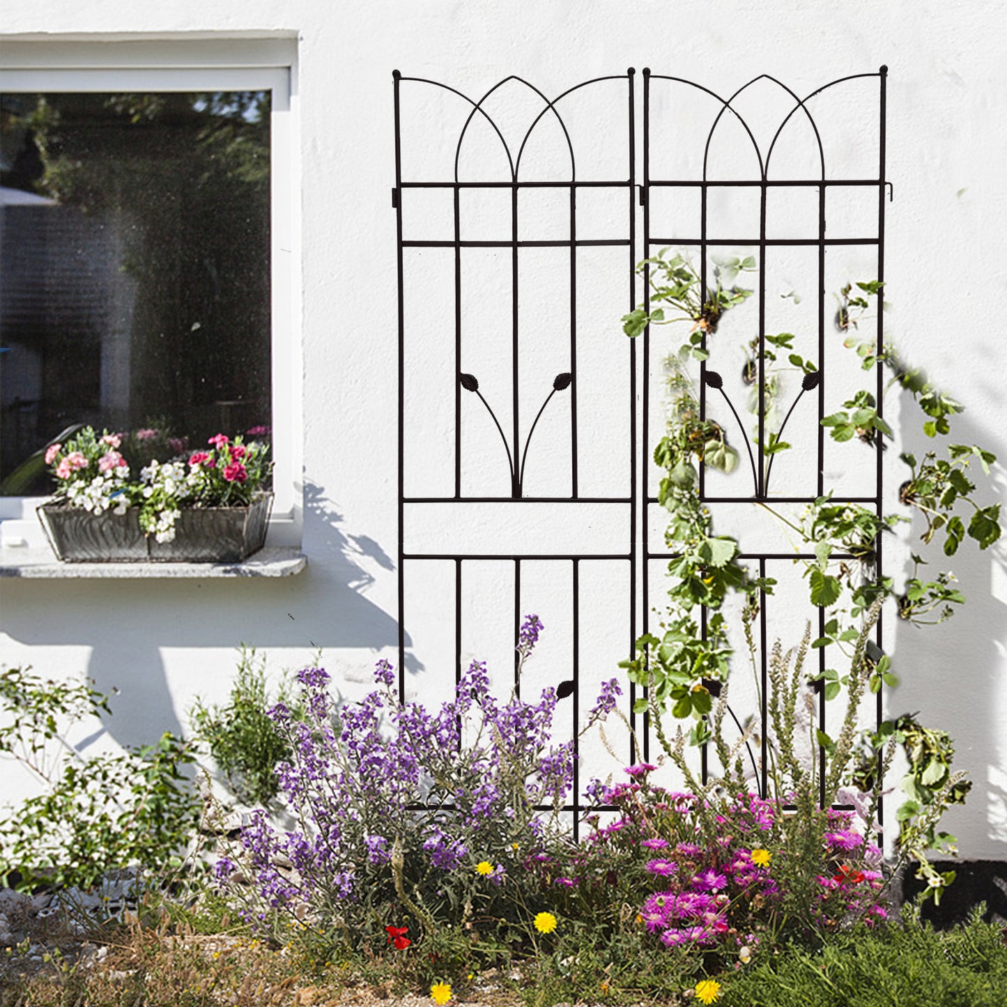 Black wrought iron garden trellis with decorative arch top ideal for climbing plants