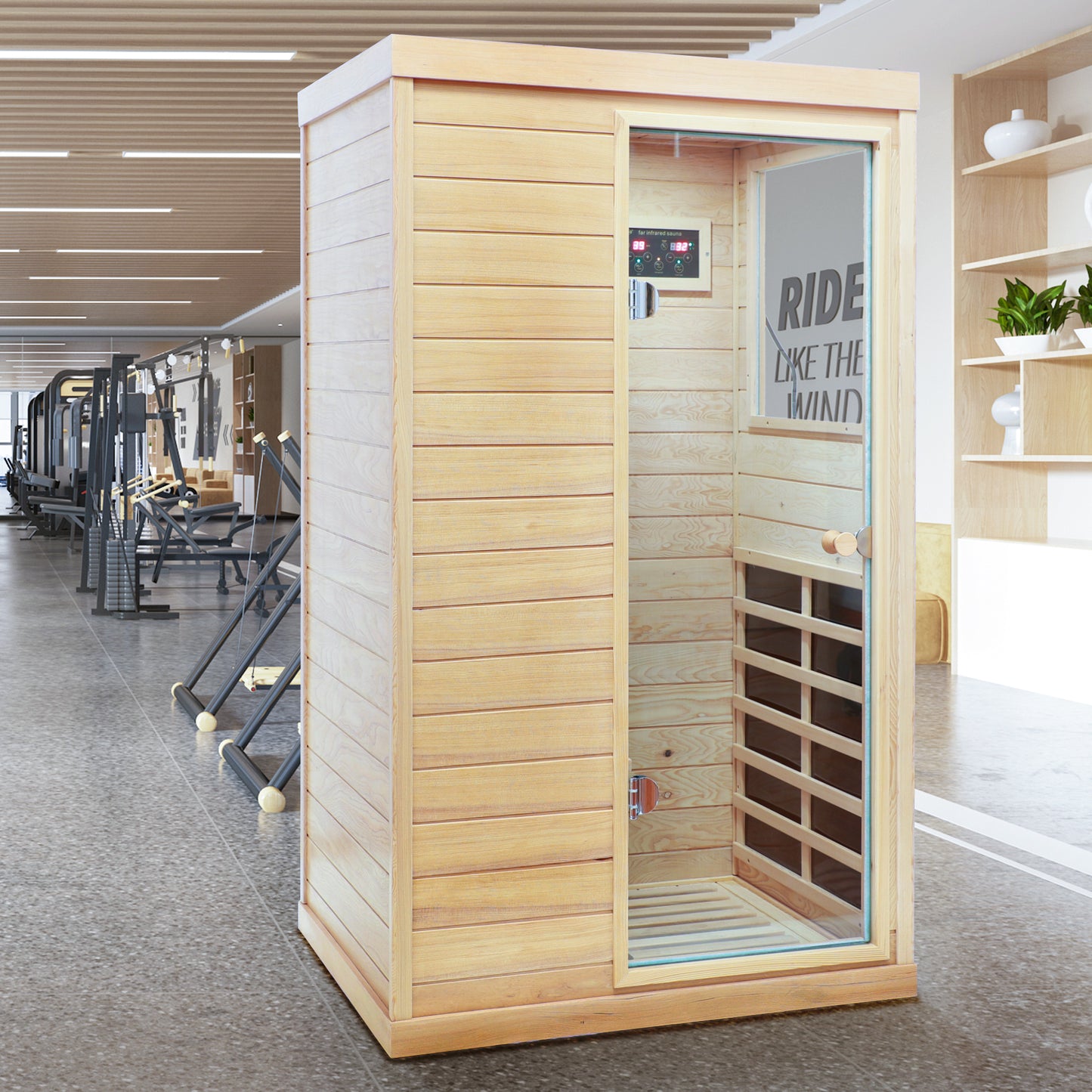 Compact wooden far infrared sauna cabin with glass door in a gym setting