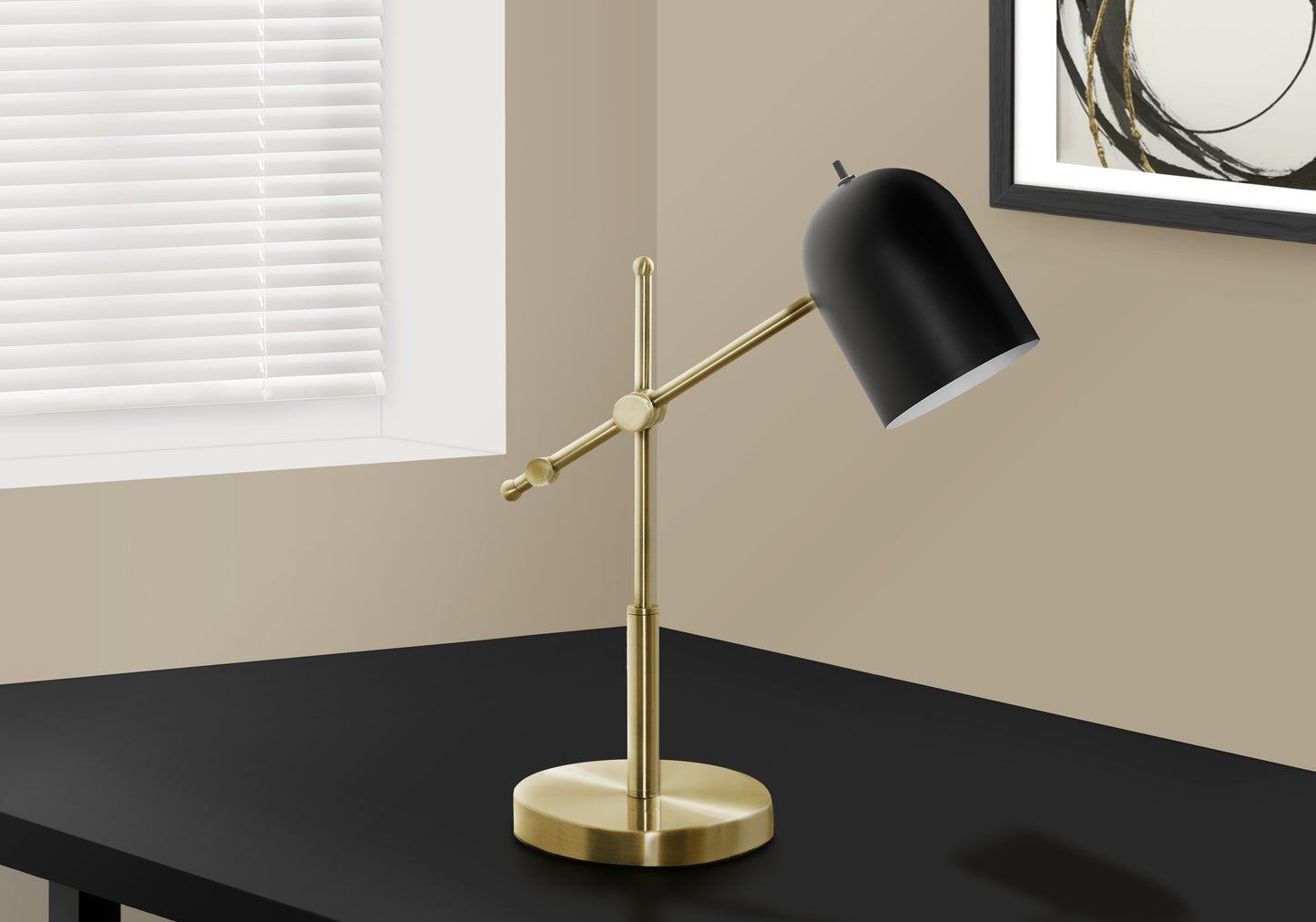 Adjustable brass desk lamp with a matte black dome shade perfect for task lighting