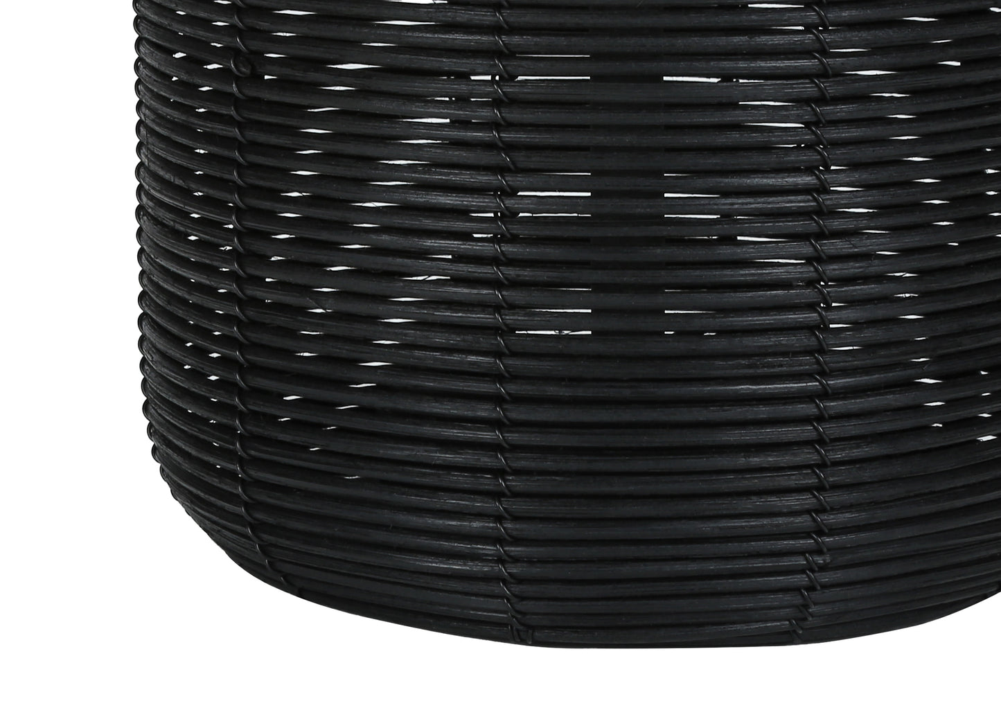 Closeup of a black woven storage basket highlighting its textured rattan material and open weave design