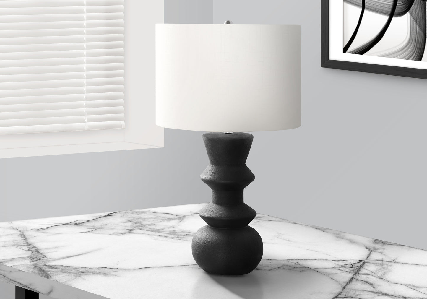 Textured black ceramic table lamp with a white drum shade modern design