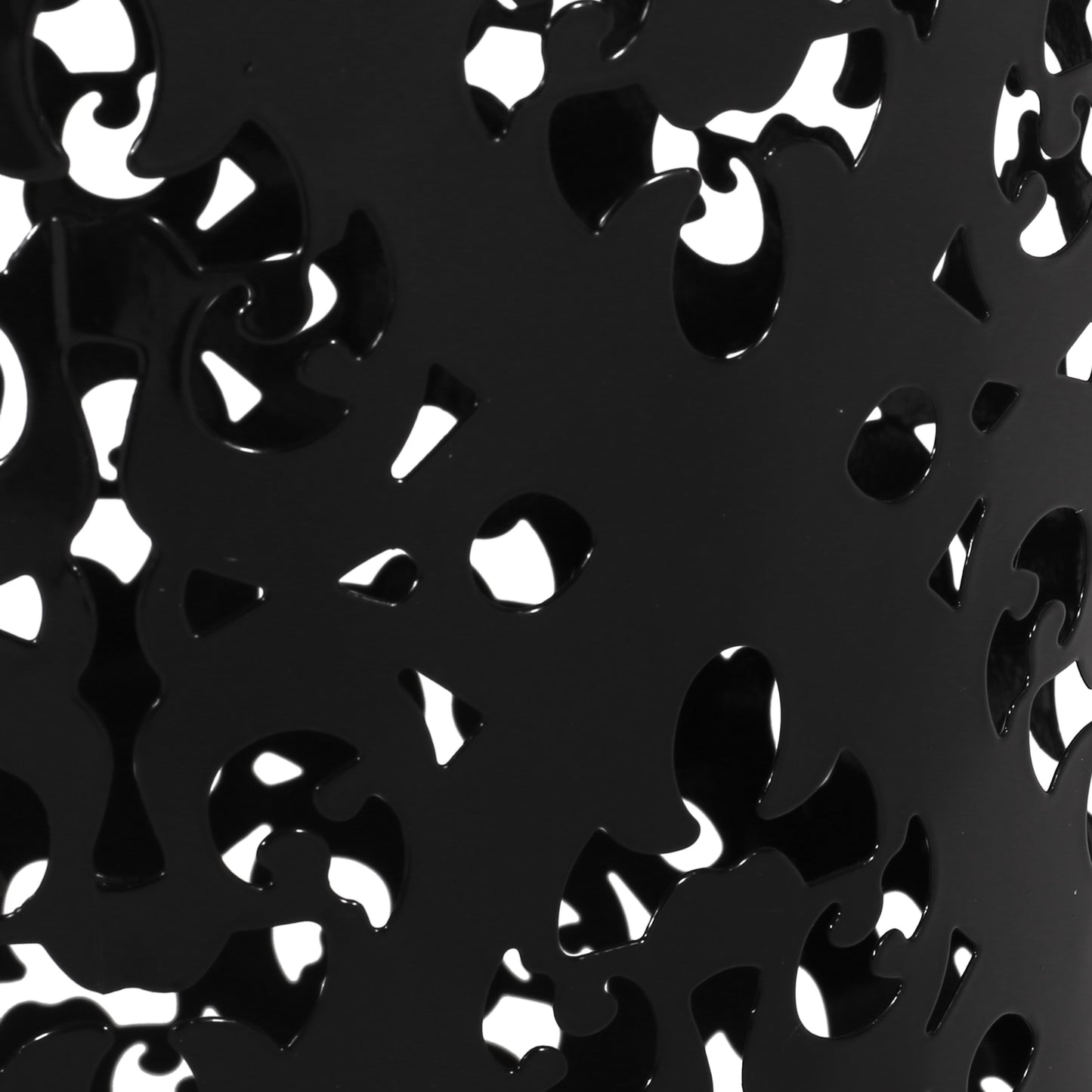 Black metal decorative screen with ornate cutouts