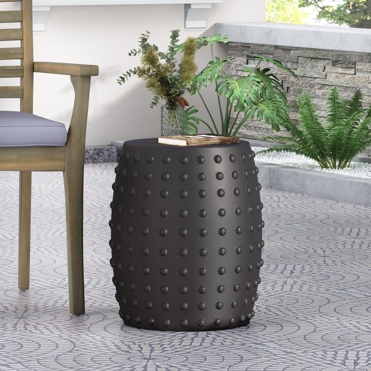 Dark gray ceramic garden stool with embossed raised circles perfect for outdoor seating