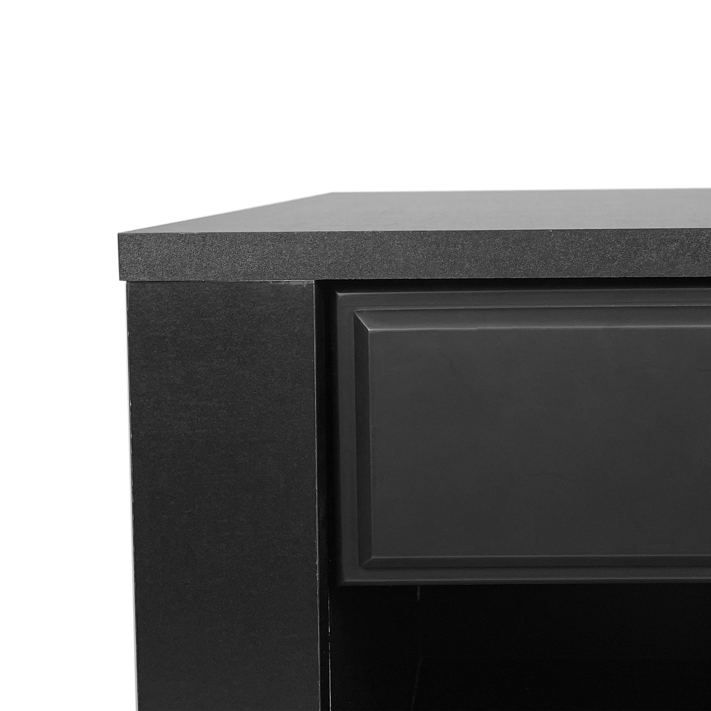 Closeup of a black textured laminate countertop edge on a modern cabinet with inset drawer detail