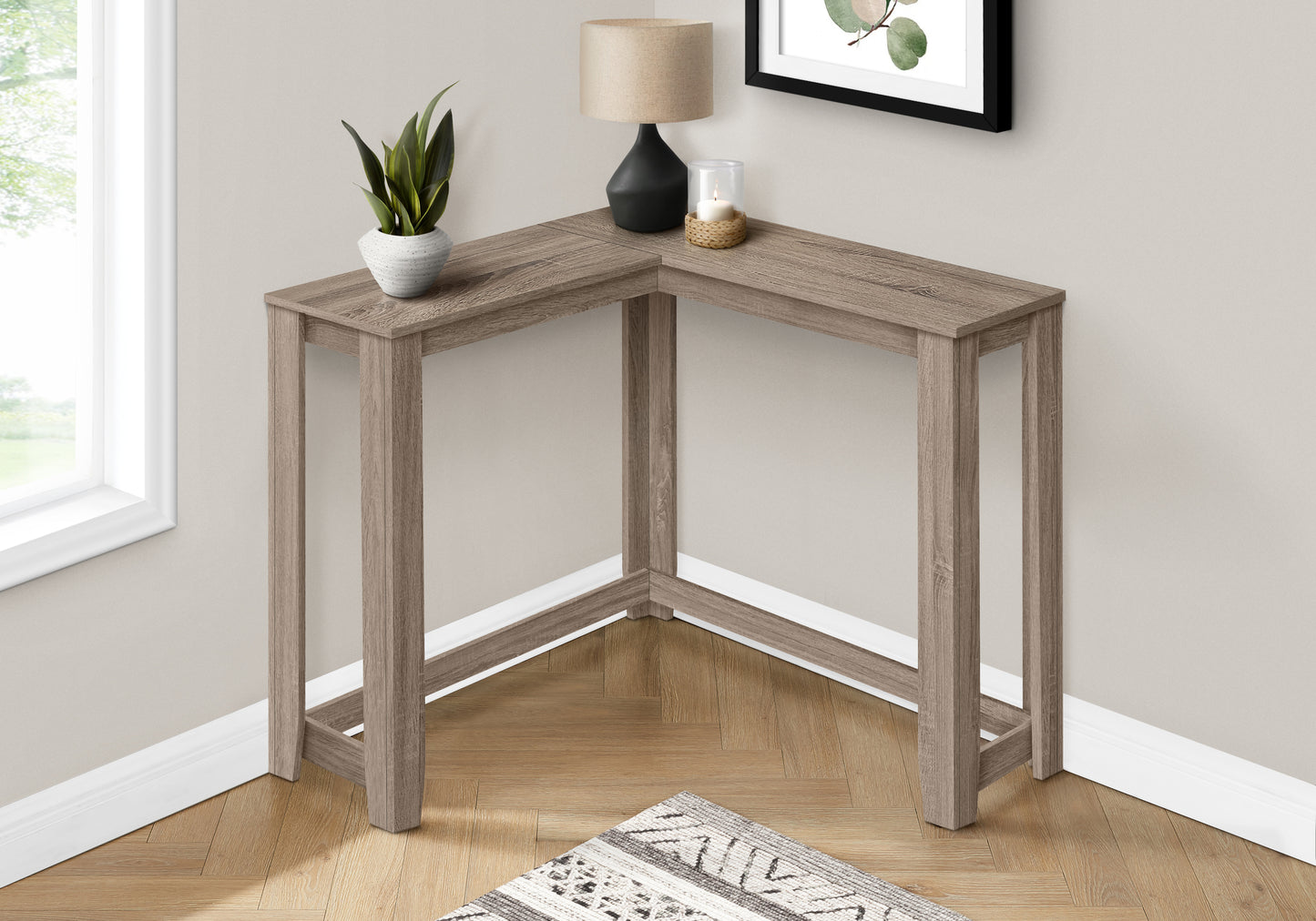 Gray wash wood corner console table with slim legs and a minimalist design