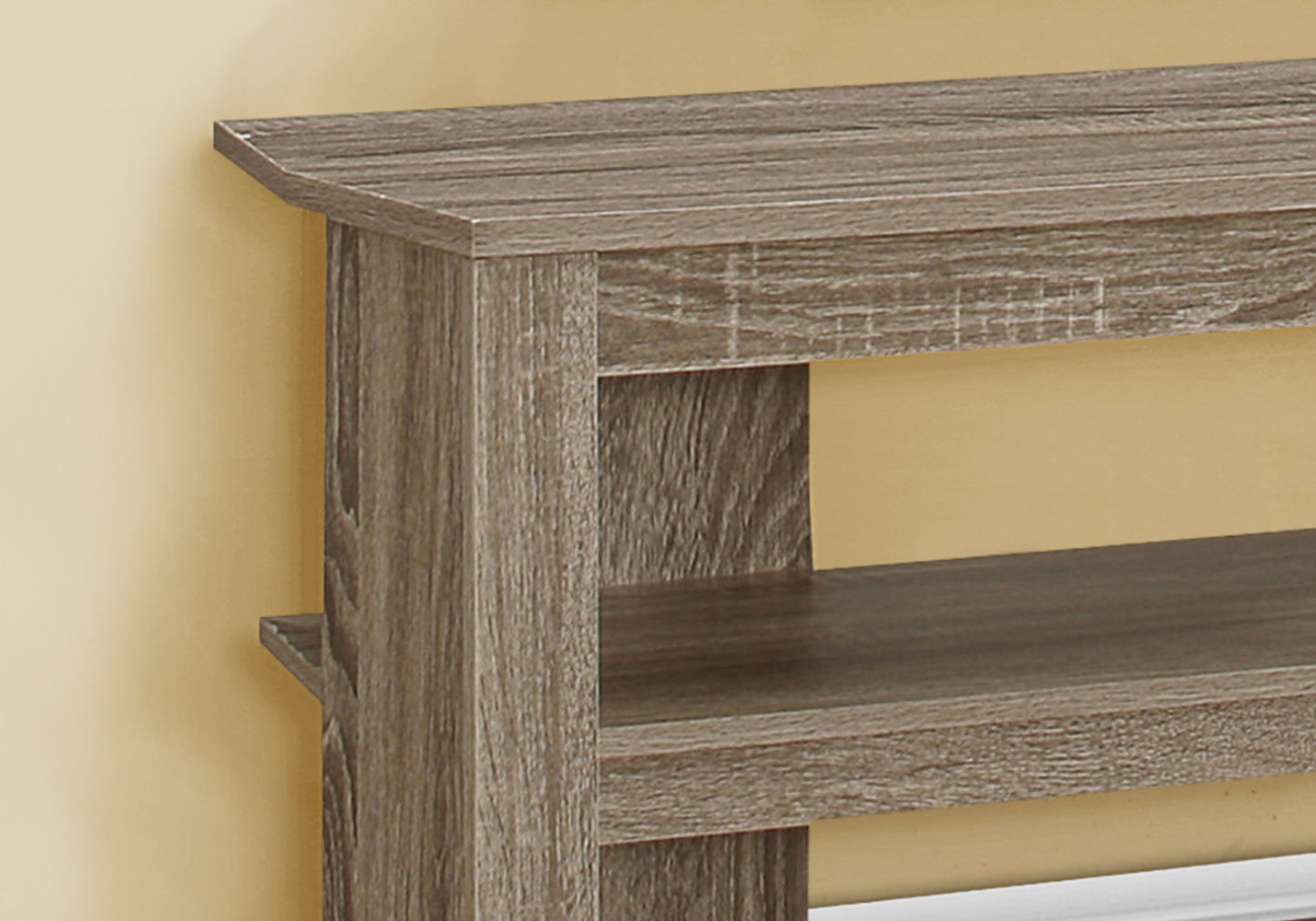 Distressed gray woodgrain bookshelf with multiple shelves suitable for home storage