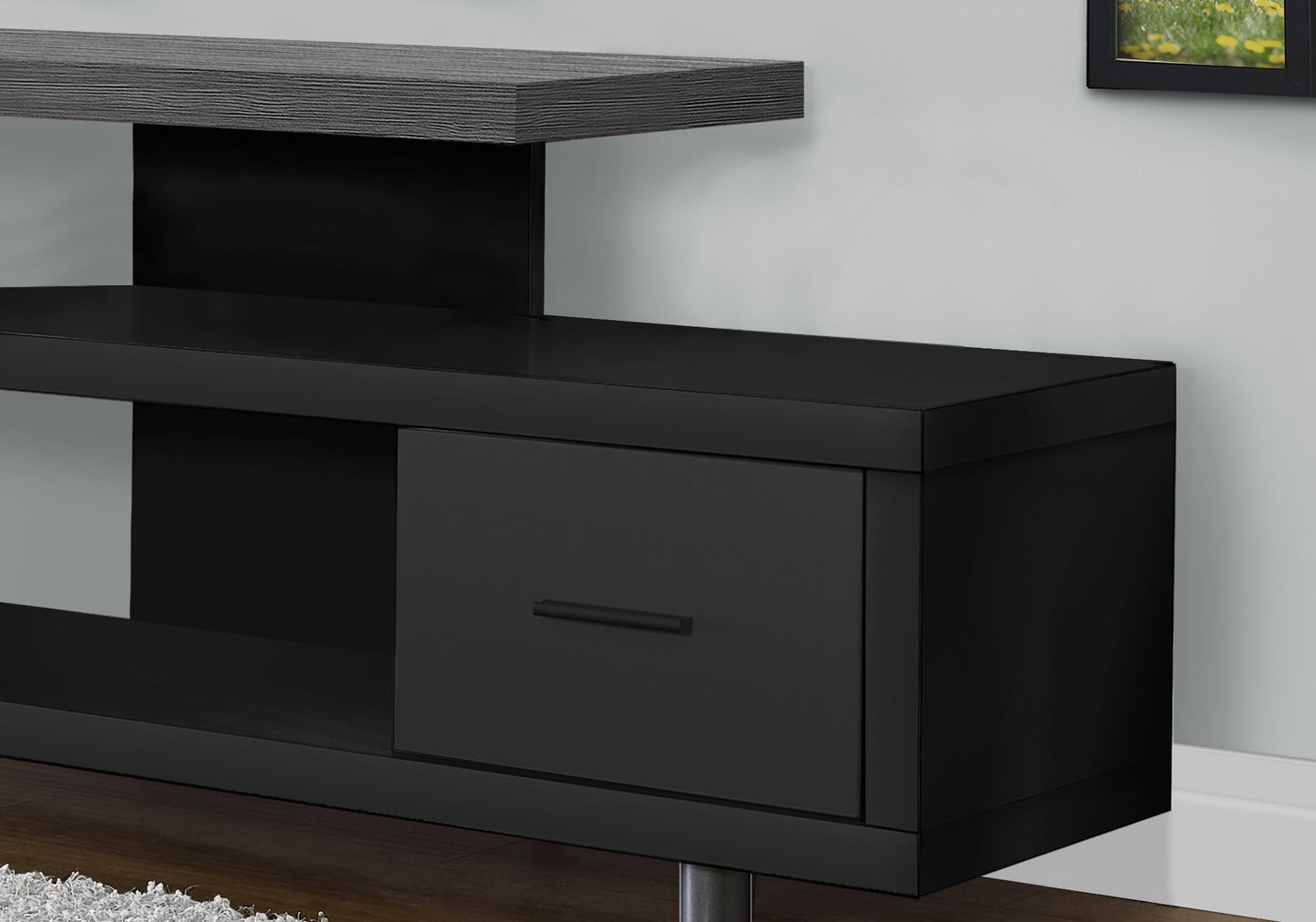 Sleek black media console with a matte finish and woodeffect top shelf