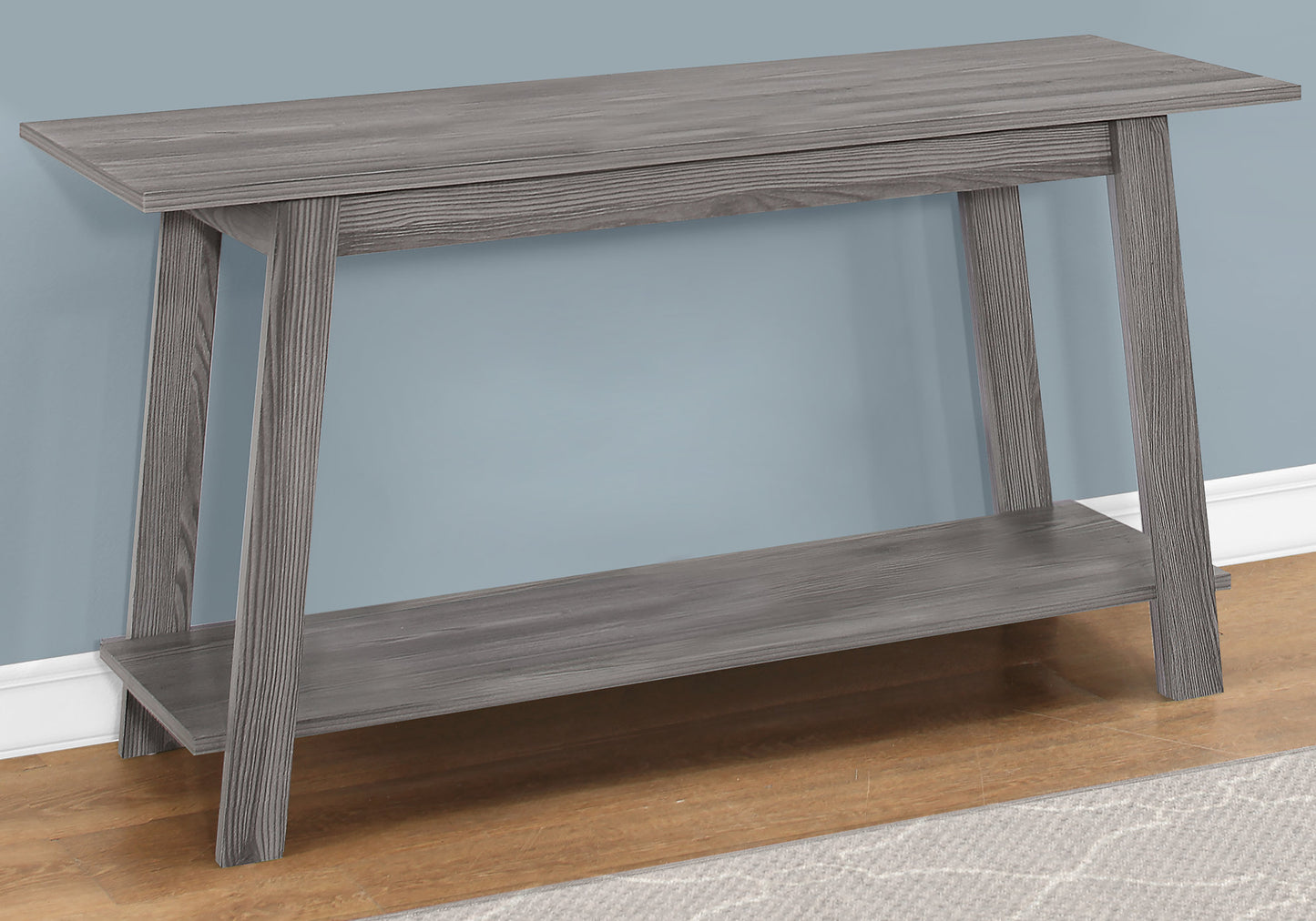 Gray wood console table with a lower shelf and tapered legs