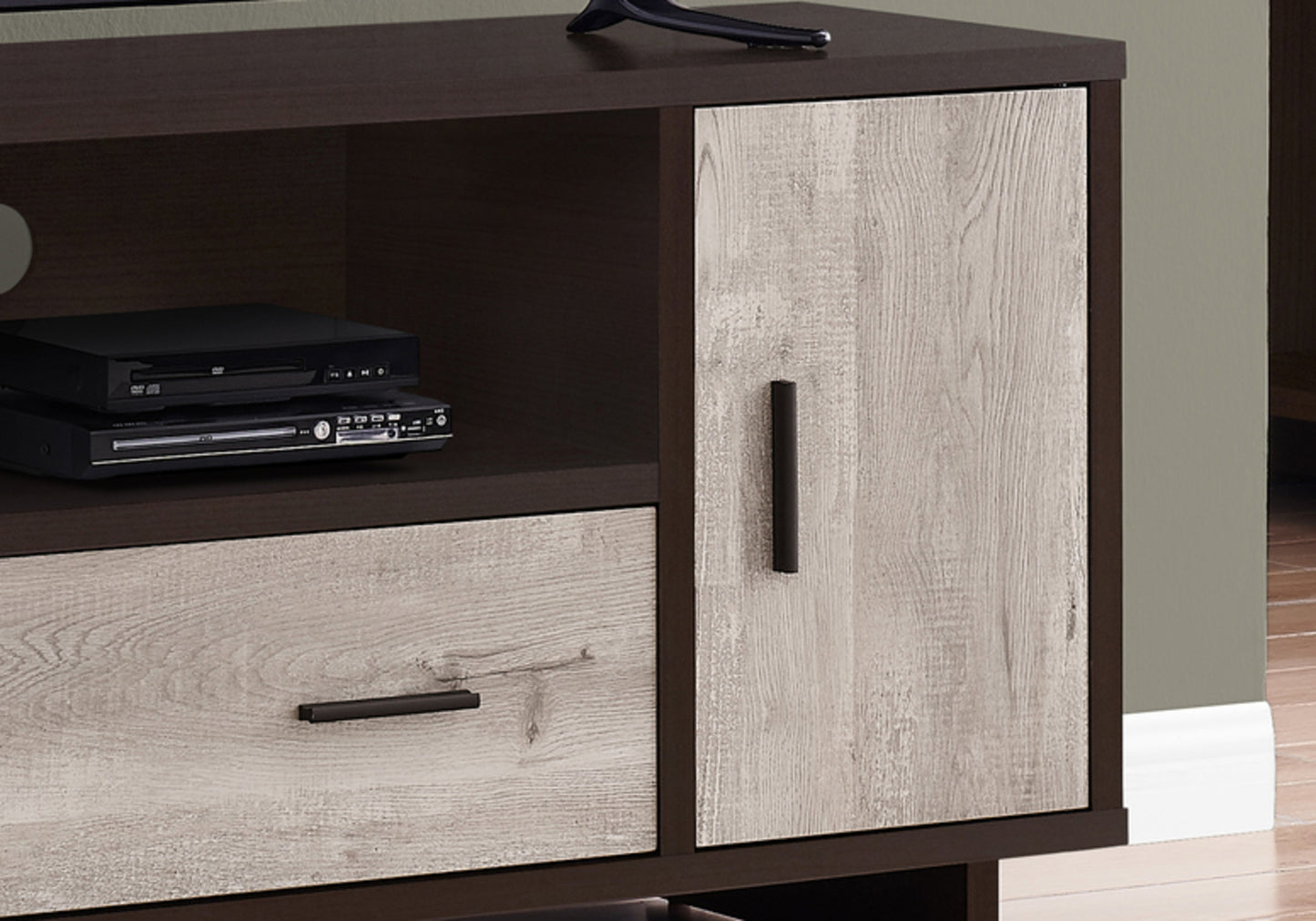 Dark wood media console with weathered oak drawer and cabinet door