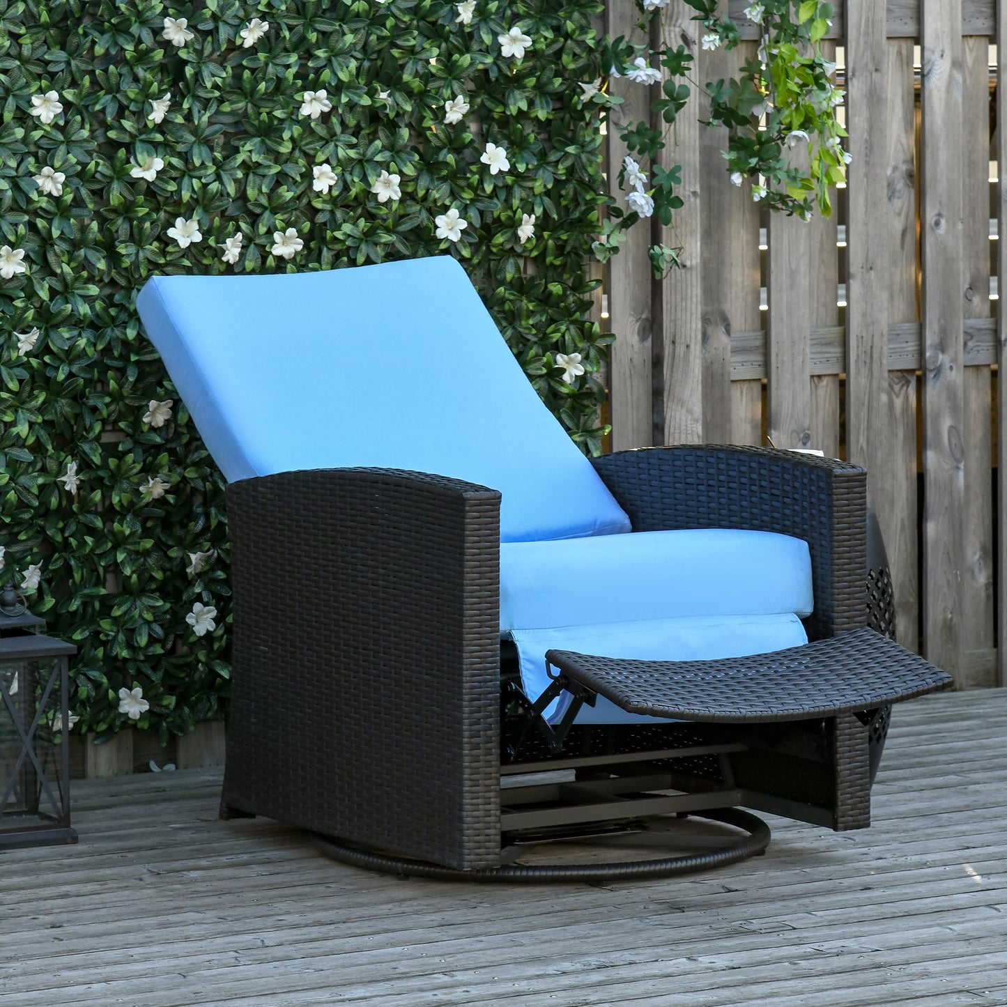 Brown wicker outdoor recliner with light blue cushions perfect for patio relaxation