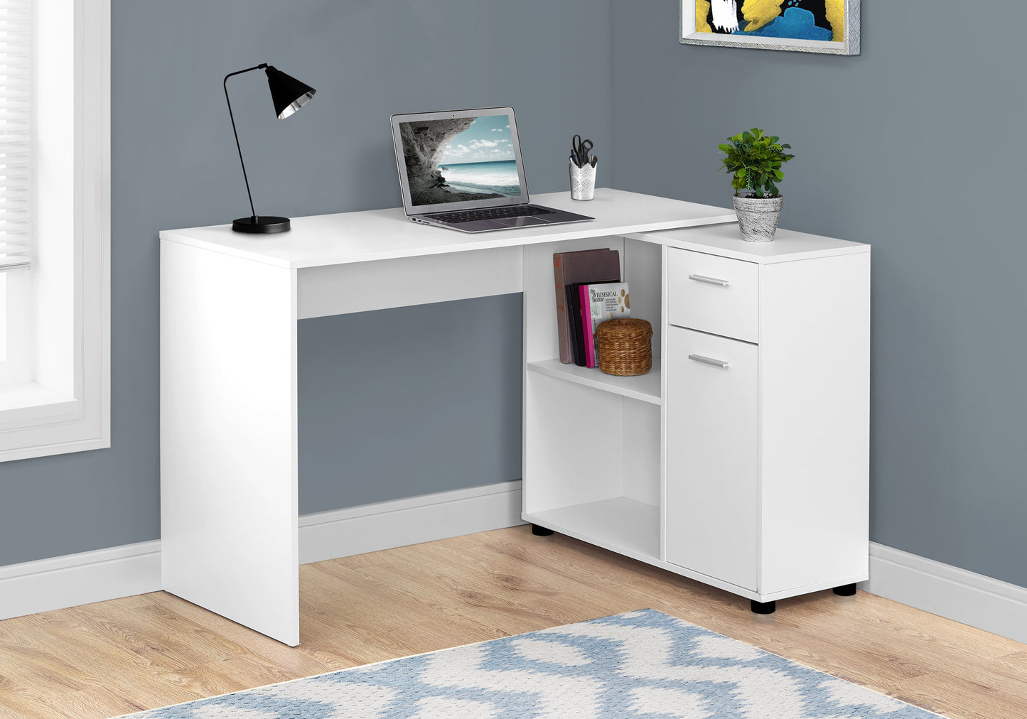White modern Lshaped desk with open shelves and two drawers perfect for a home office