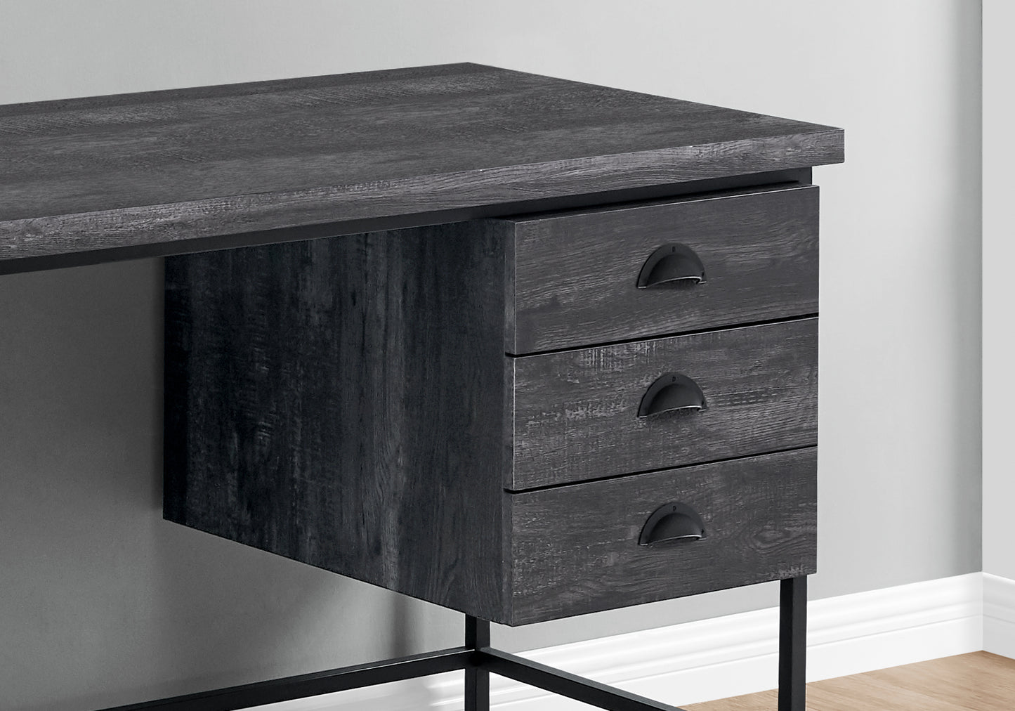 Dark wood finish desk with three drawers and black metal hardware for home office storage