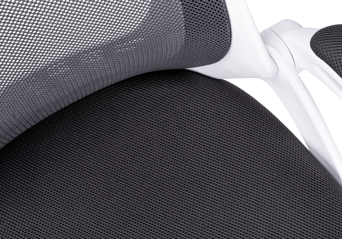 Closeup of black mesh fabric on a modern ergonomic office chair seat