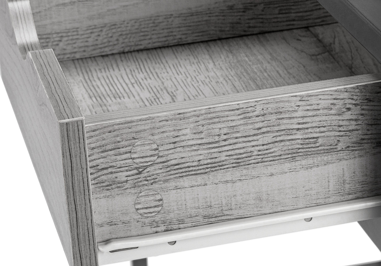 Closeup of a grey woodgrain drawer interior with a white metal slide mechanism visible
