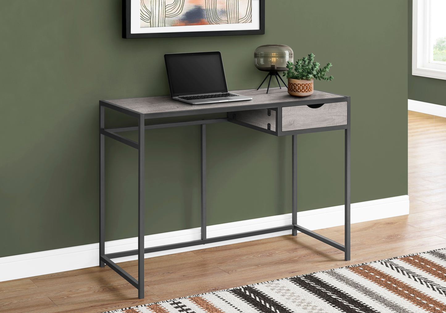 Gray wood grain narrow desk with black metal frame and single drawer