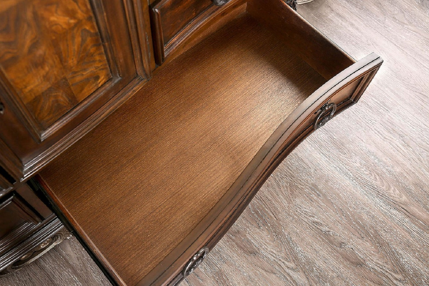 Open antique mahogany dresser drawer showcasing rich wood grain