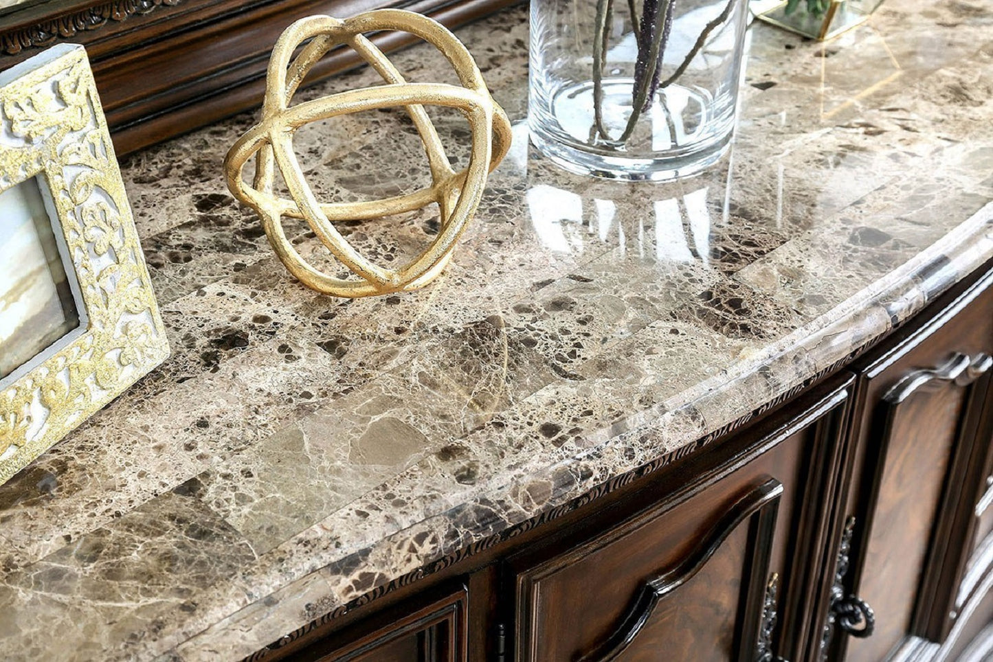 Gold sphere accent on polished marble countertop