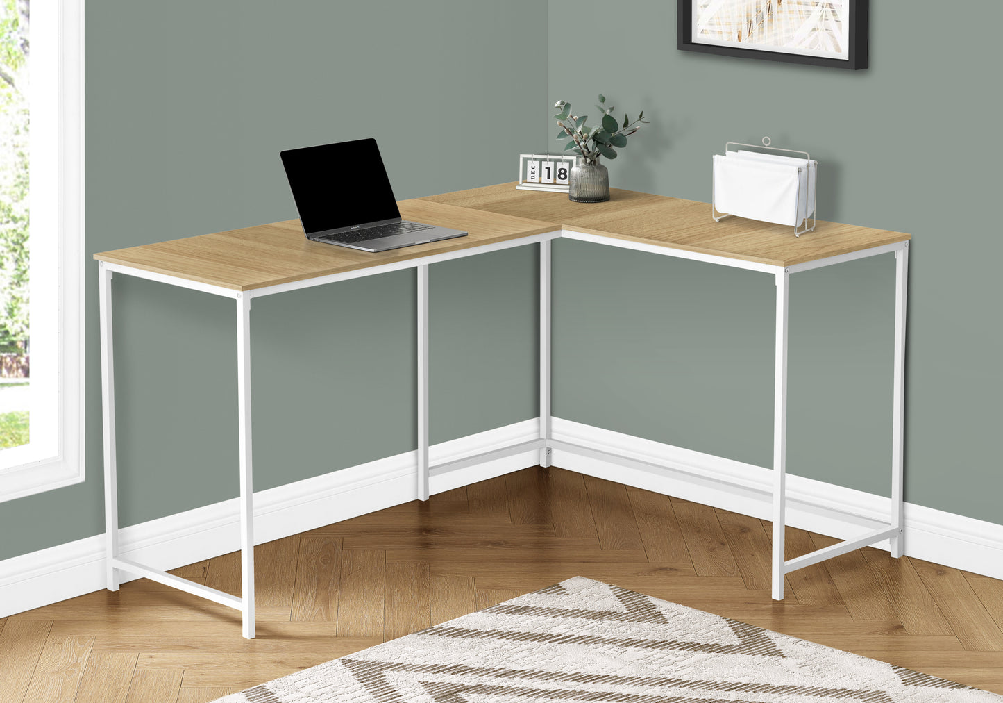 Light oak Lshaped corner desk with white metal frame and a laptop