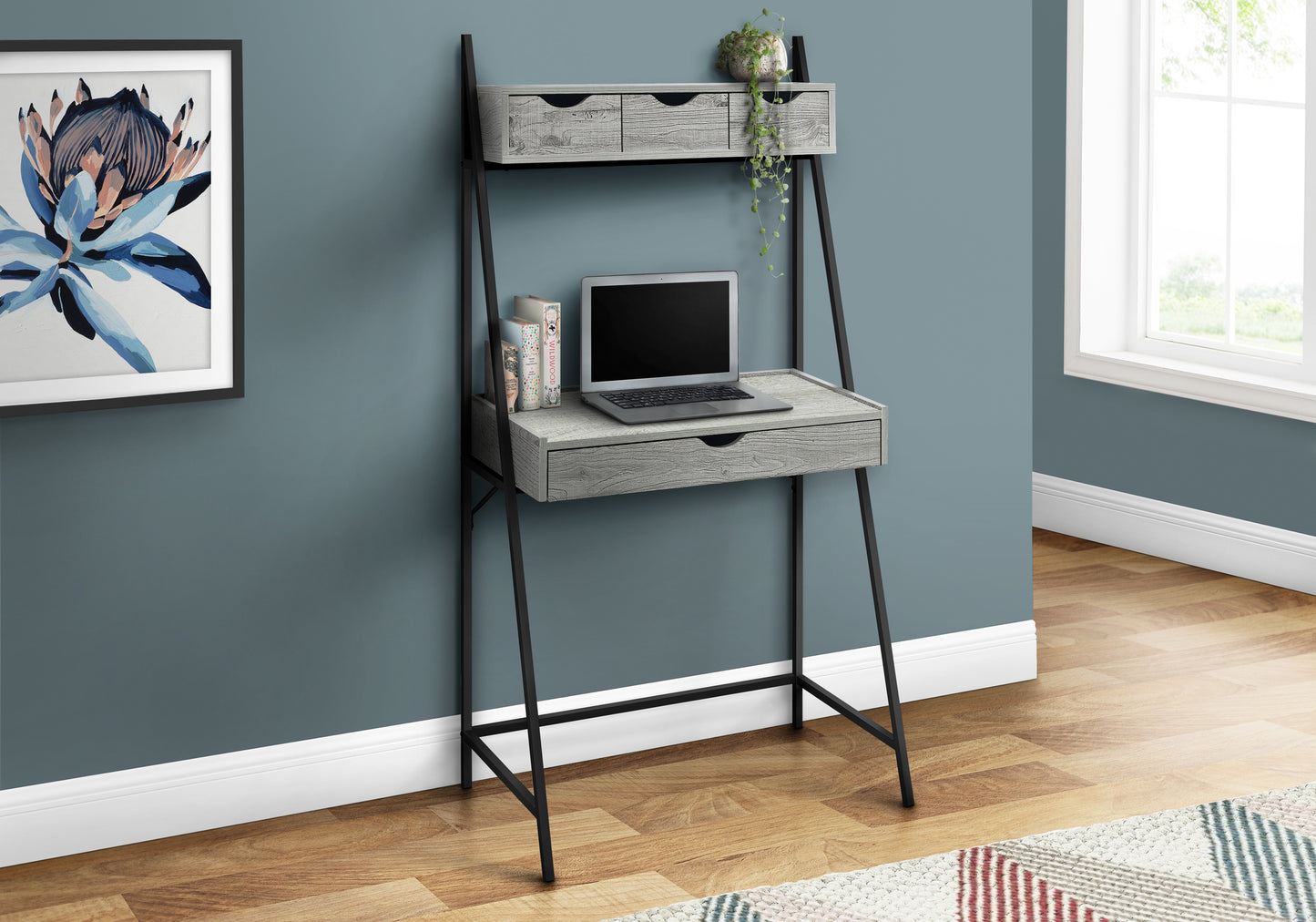Gray wood ladder desk with laptop and books
