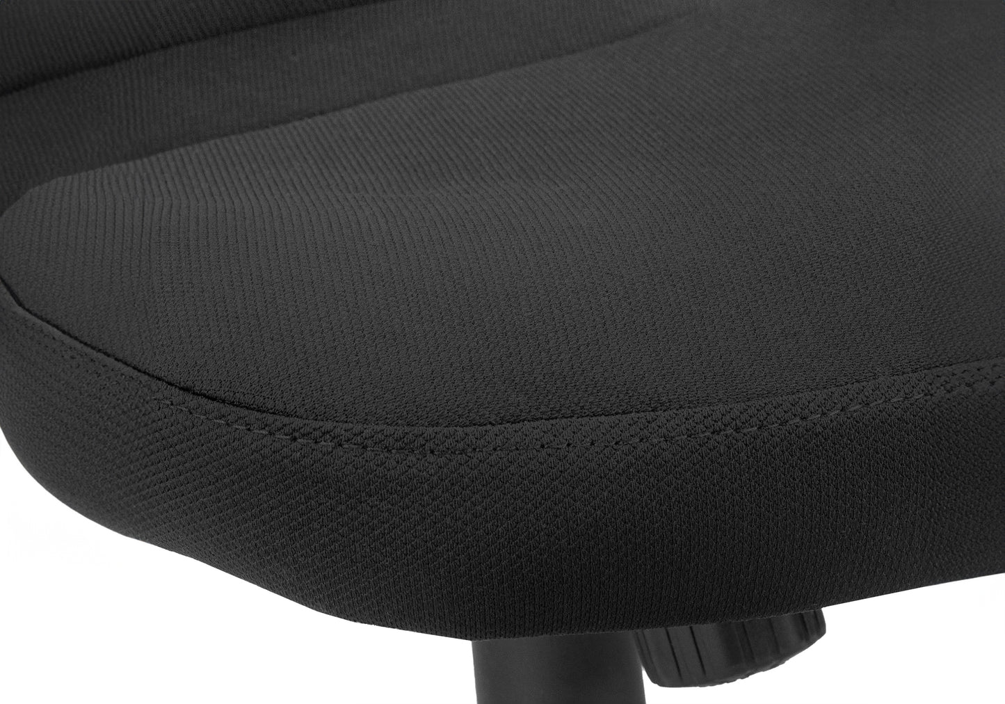 Closeup of a black office chair seat showcasing textured fabric and stitching