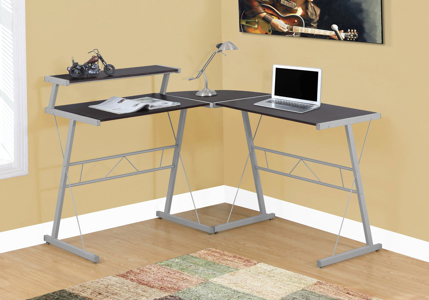 Dark brown corner computer desk with silver metal frame and two shelves