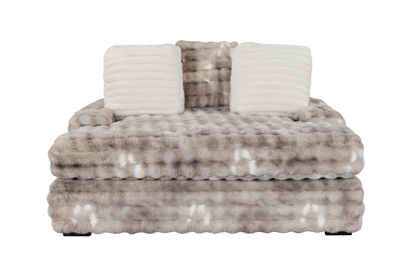 Plush grey and white faux fur chaise lounge with two cream textured throw pillows