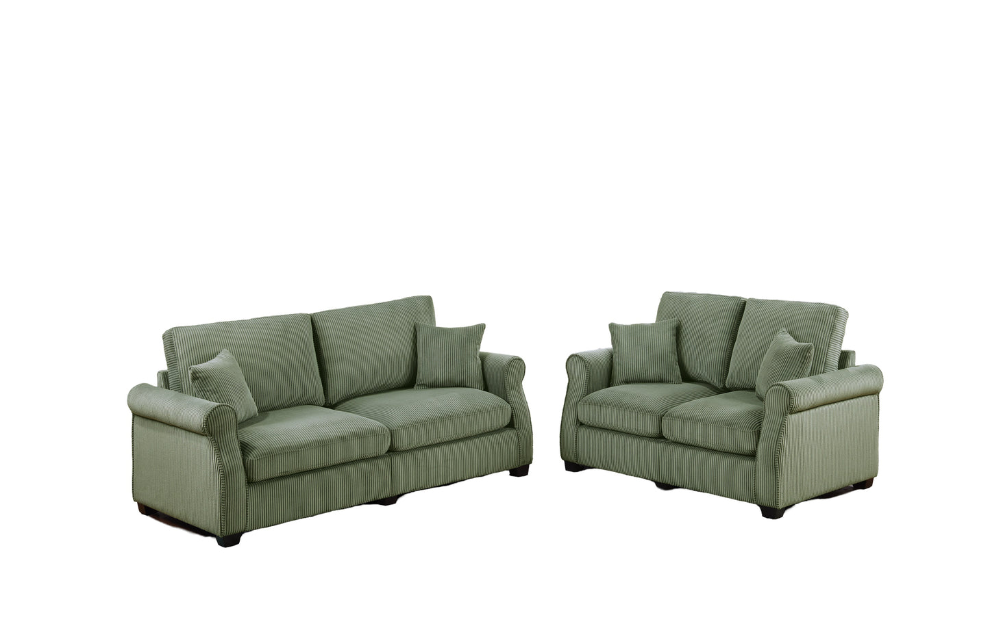 Two sage green corduroy sofas with plush cushions and rolled arms perfect for a cozy living room