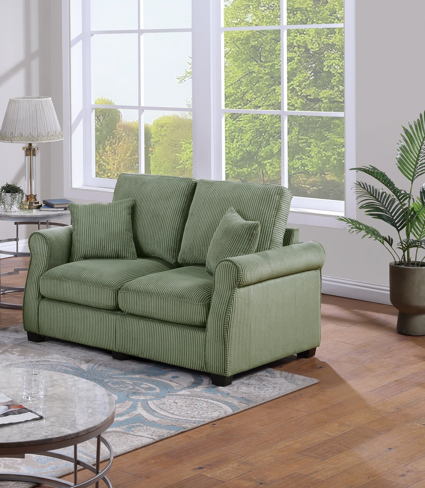 Green corduroy sofa with plush cushions perfect for a cozy living room