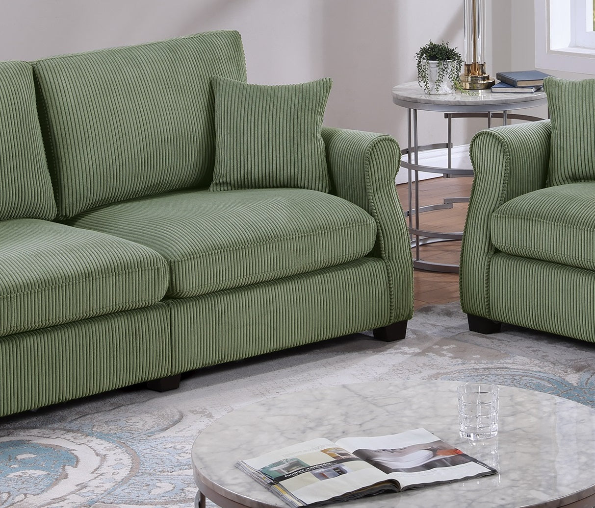 Green corduroy sofa with plush cushions perfect for a cozy living room setting