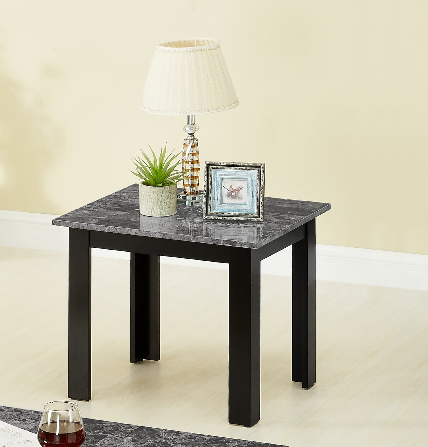 Square marble top side table with black legs perfect for living room decor