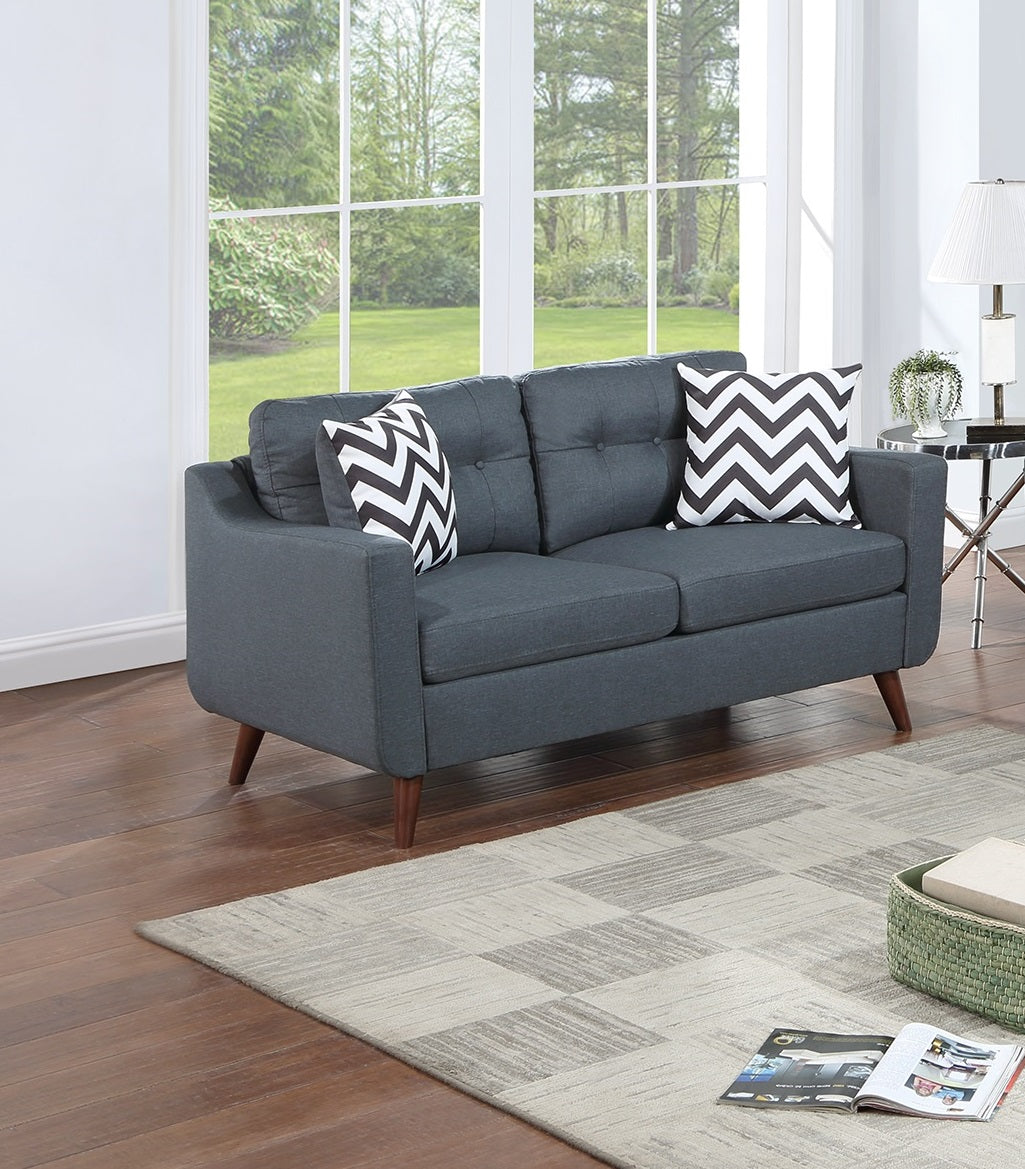 Dark grey tufted loveseat with tapered wooden legs perfect for small living spaces