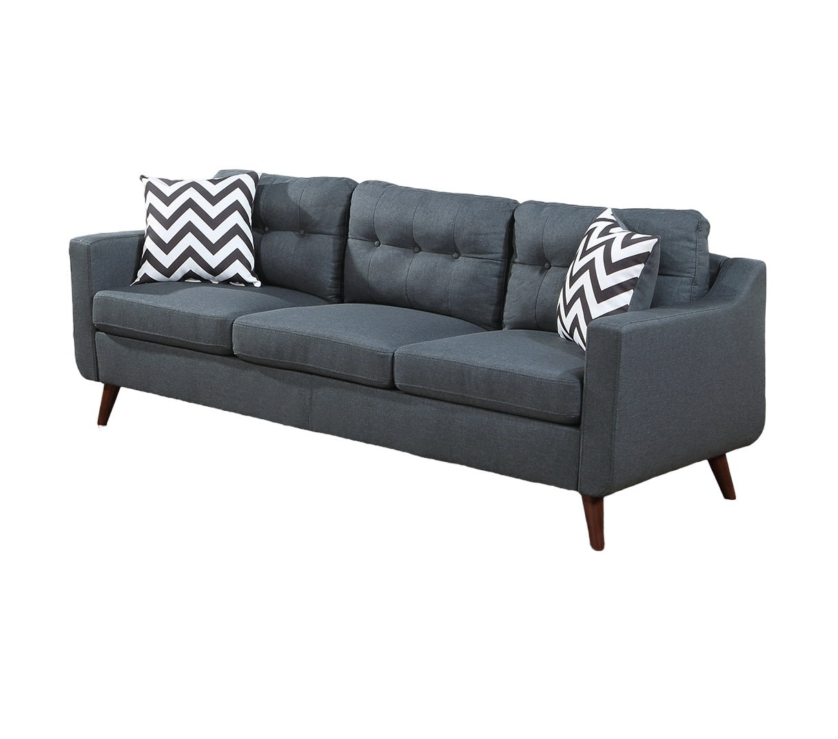 Modern dark grey fabric sofa with tufted back and chevron pillows