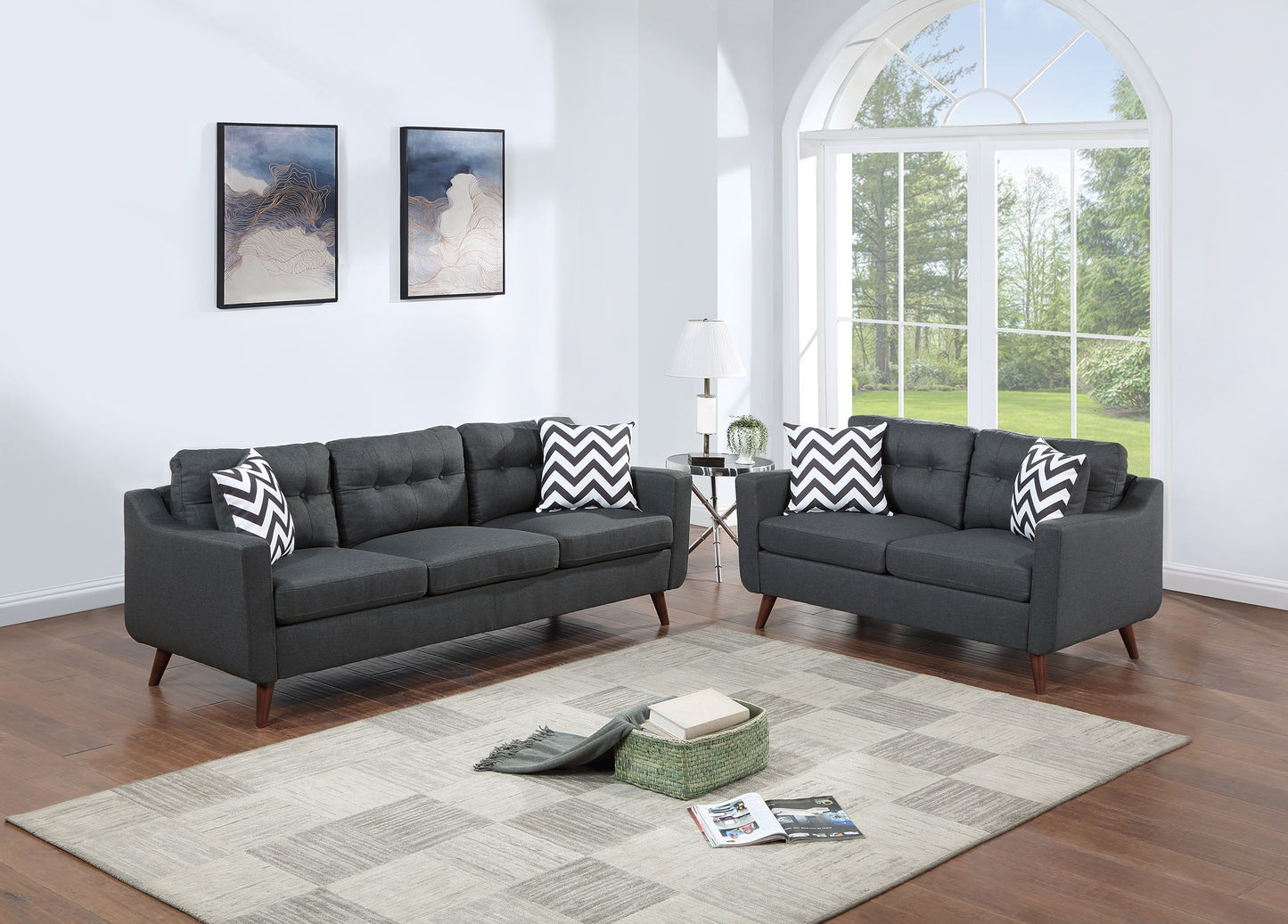Charcoal grey tufted sofa with chevron pillows for living room comfort
