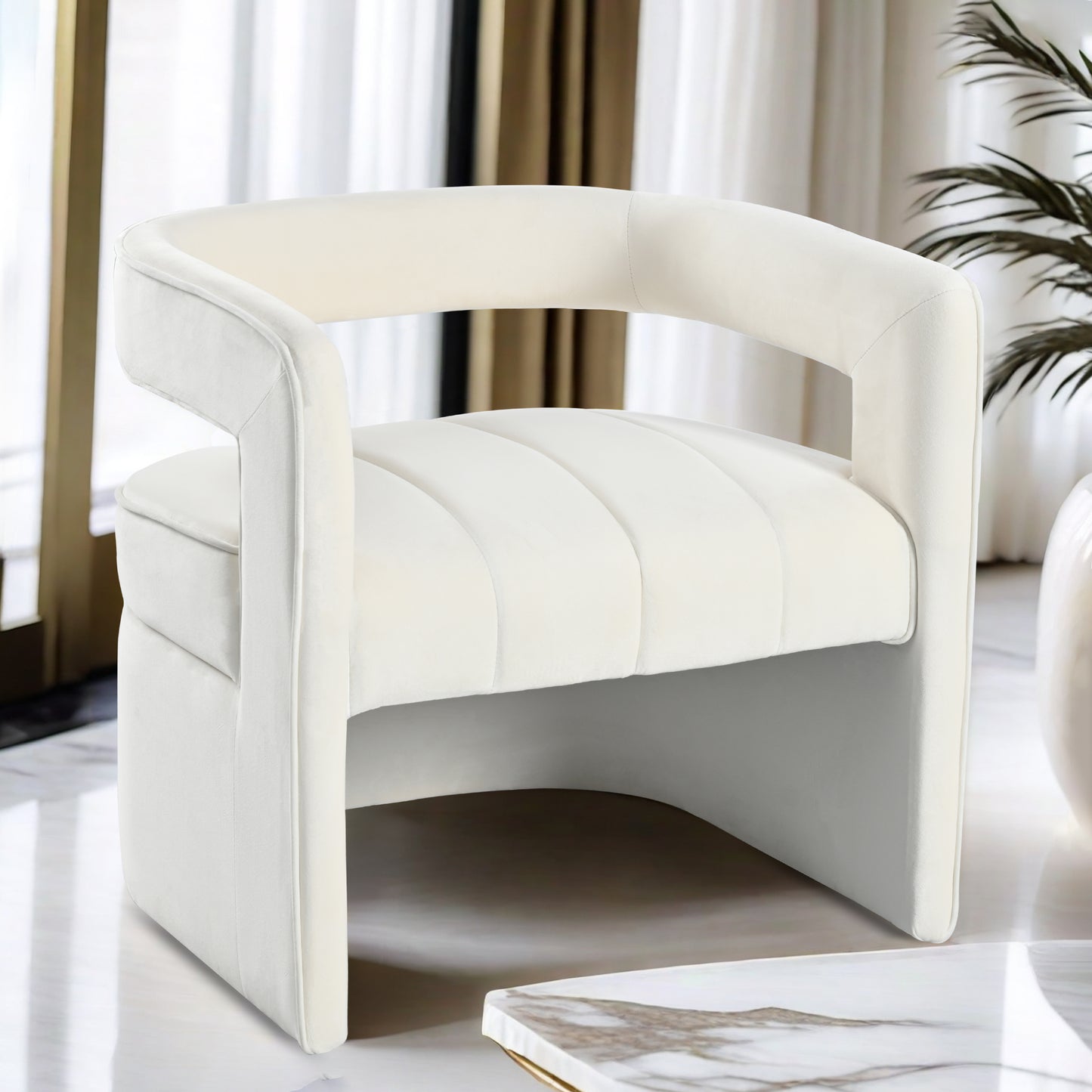 Cream velvet accent chair with channeled seat and curved arms