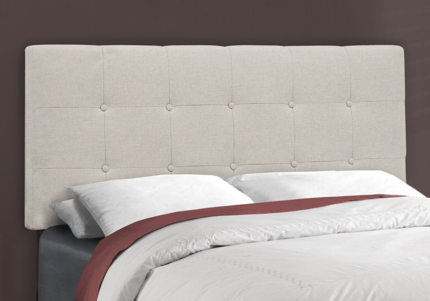 Tufted linen beige headboard with button accents for a modern bedroom