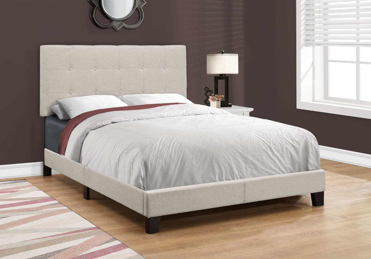 Tufted beige fabric bed frame with buttontufting on the headboard and a low profile design