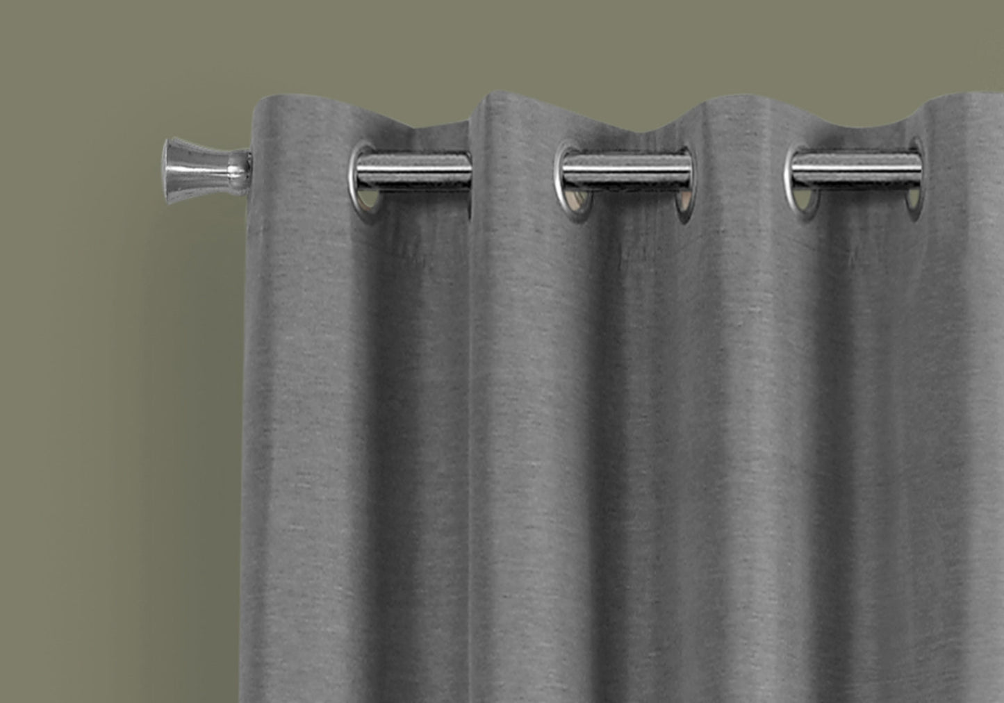 Closeup of a silver grommet curtain rod with textured grey blackout curtains