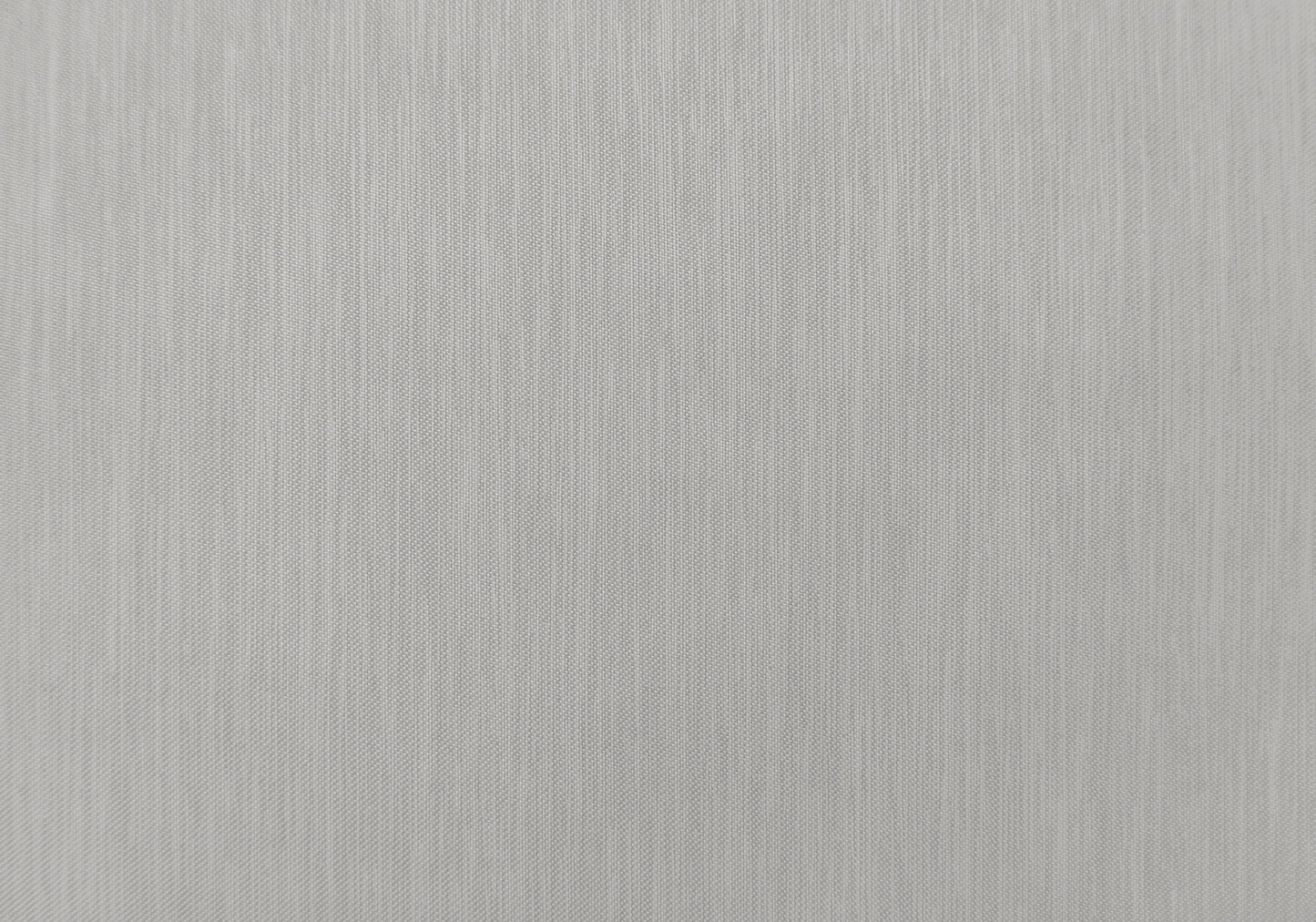 Closeup of textured grey linen fabric with vertical slub detail