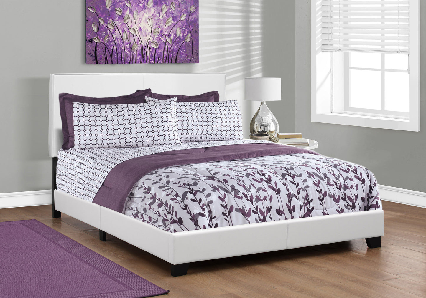 White faux leather bed frame with purple and white floral bedding set