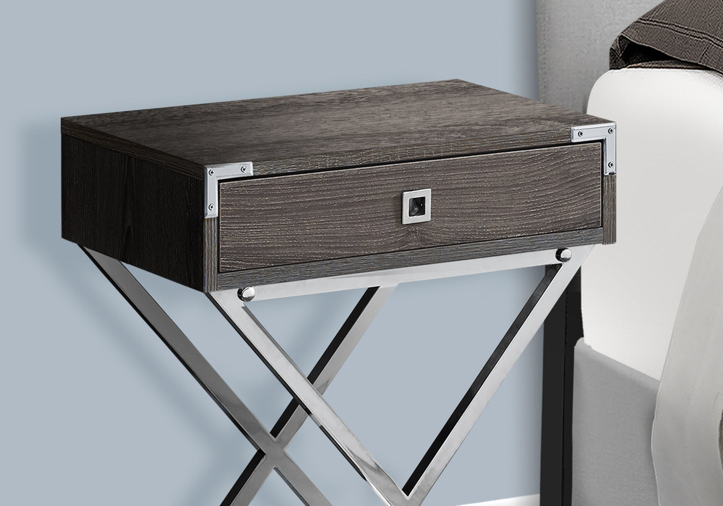 Dark wood bedside table with a silver drawer pull and metallic Xshaped legs