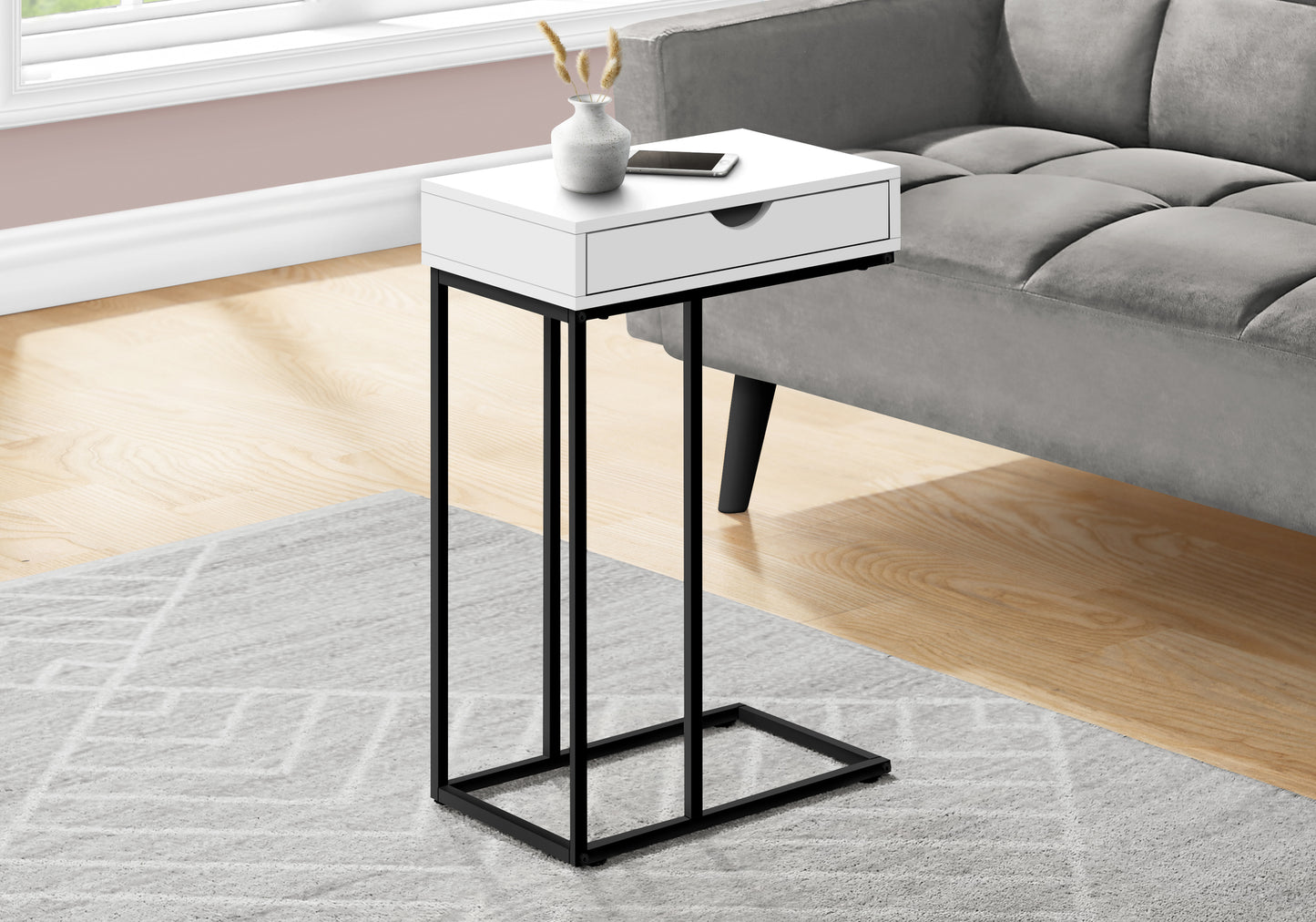 White ctable with black metal frame single drawer and modern design beside gray sofa