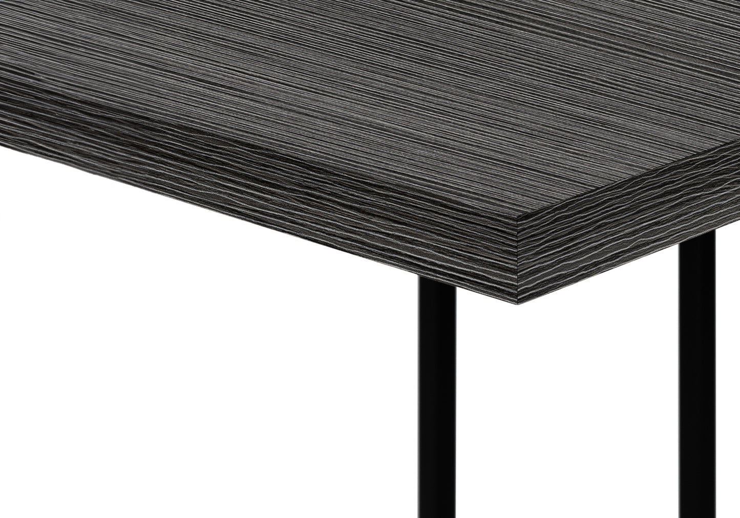 Closeup of a modern dark wood laminate desk surface with a subtle linear grain pattern
