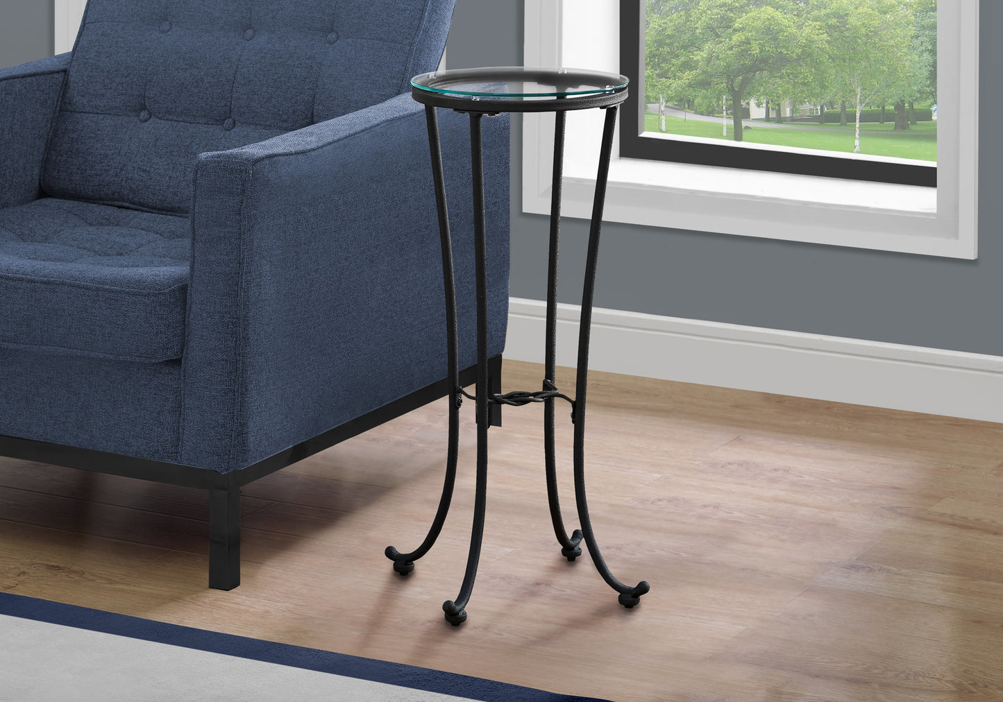 Small black metal accent table with round glass top elegant for living room decor