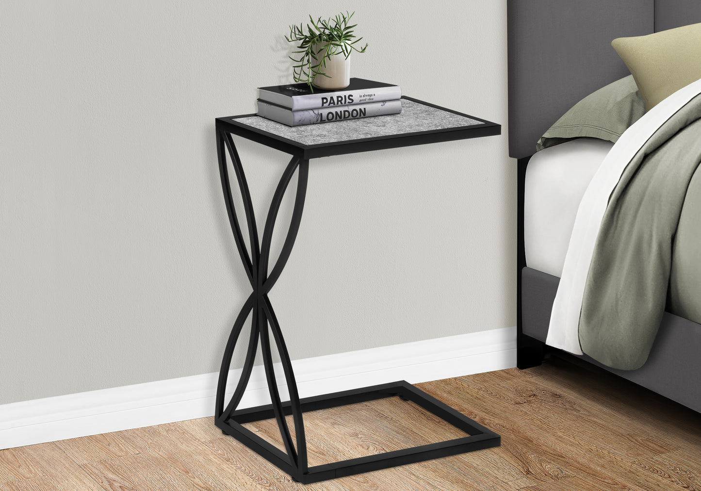 Sleek black metal side table with gray marble top perfect for bedside use
