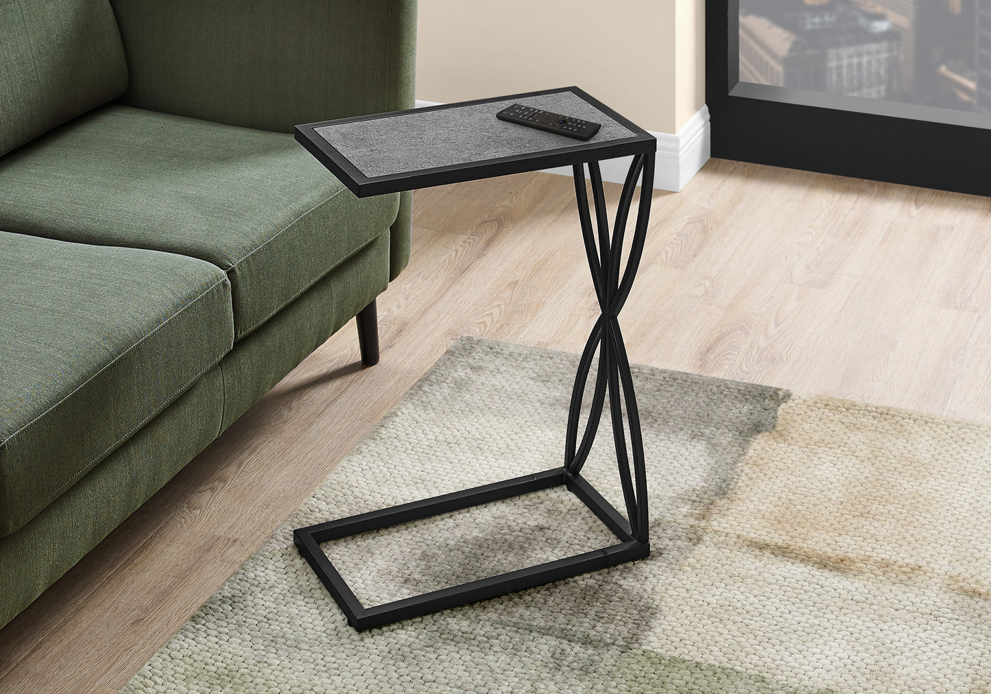 Black metal Ctable with grey textured top perfect for living room couch