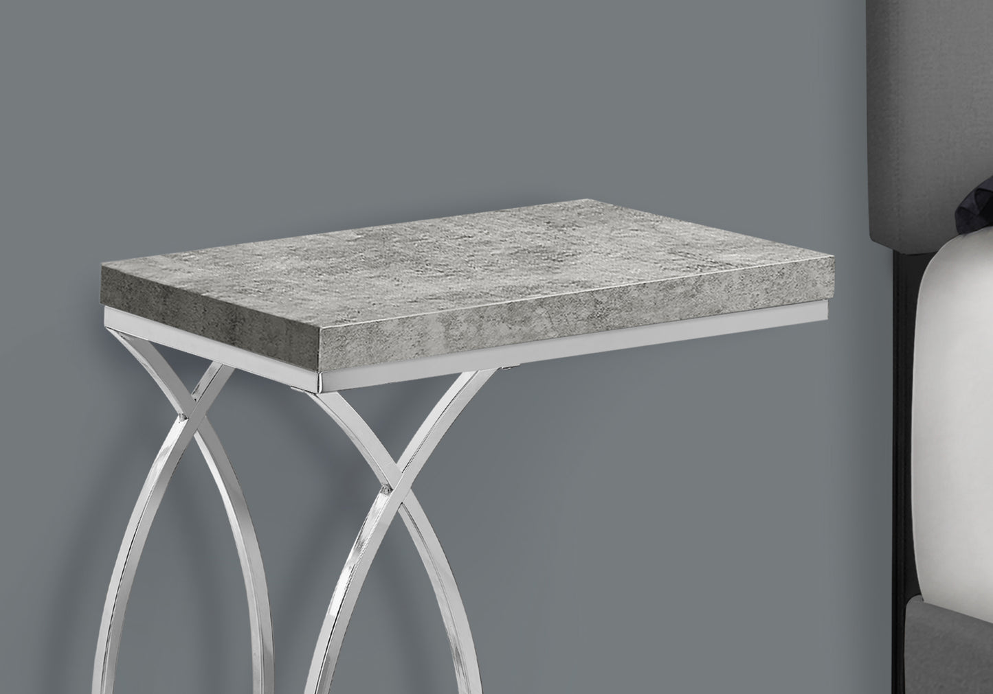 Gray concrete top accent table with chrome legs and curved base