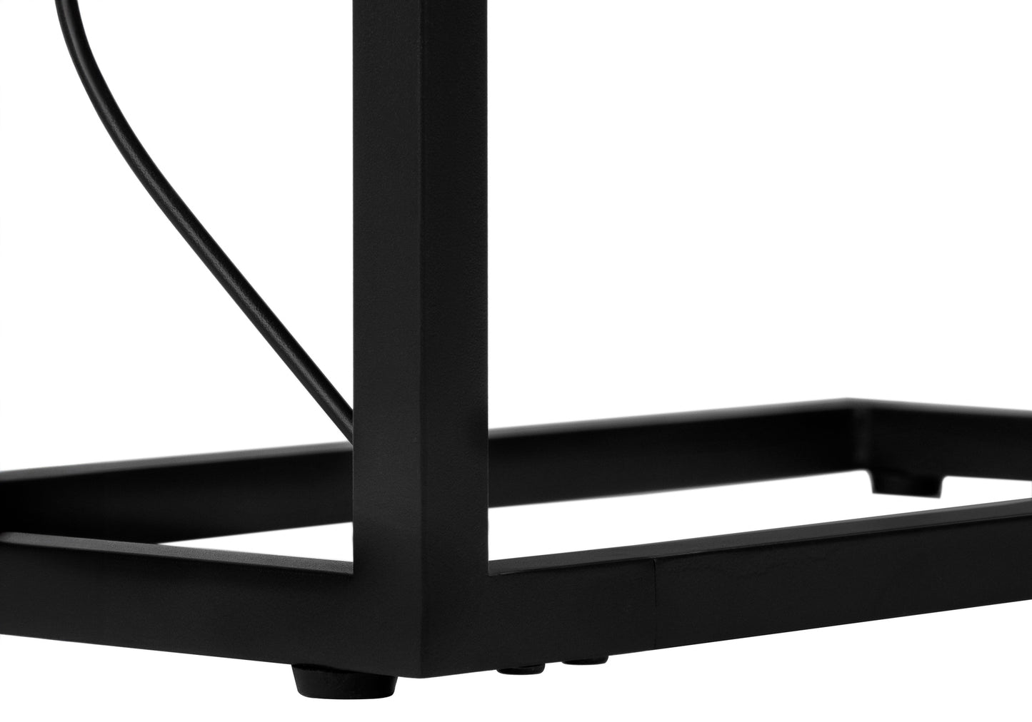 Black metal frame of a modern side table highlighting sleek design