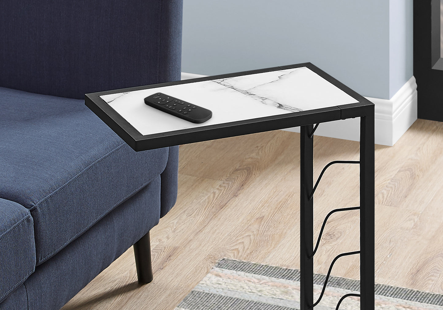 Black Ctable with white marble top and remote perfect for living room convenience
