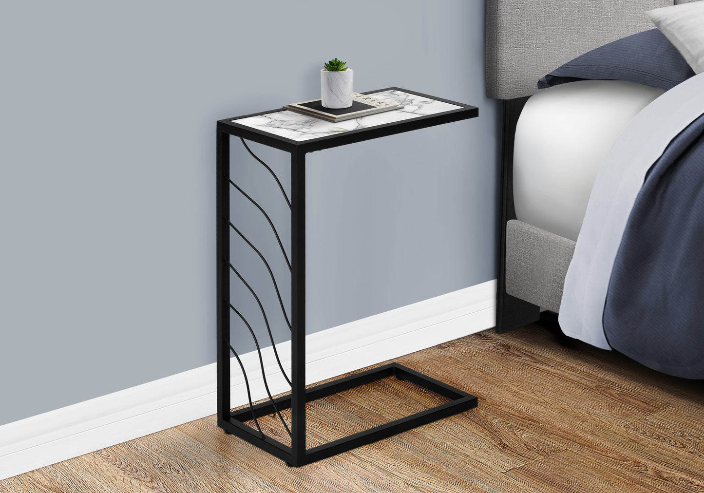 Marble top C table with black metal frame and decorative waves perfect for living rooms